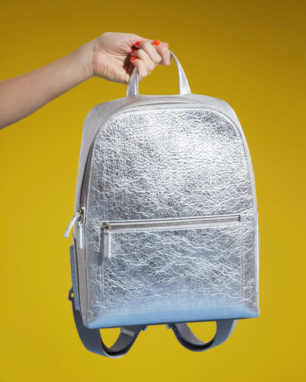 A silver leather backpack made with Piñatex by LUXTRA